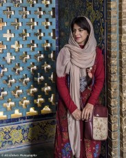 Beautifully dressed young woman in the female Sheikh Lotfollah Mosque, Ali Qapu Palace, Naqsh-e Jahan Square, Esfahan